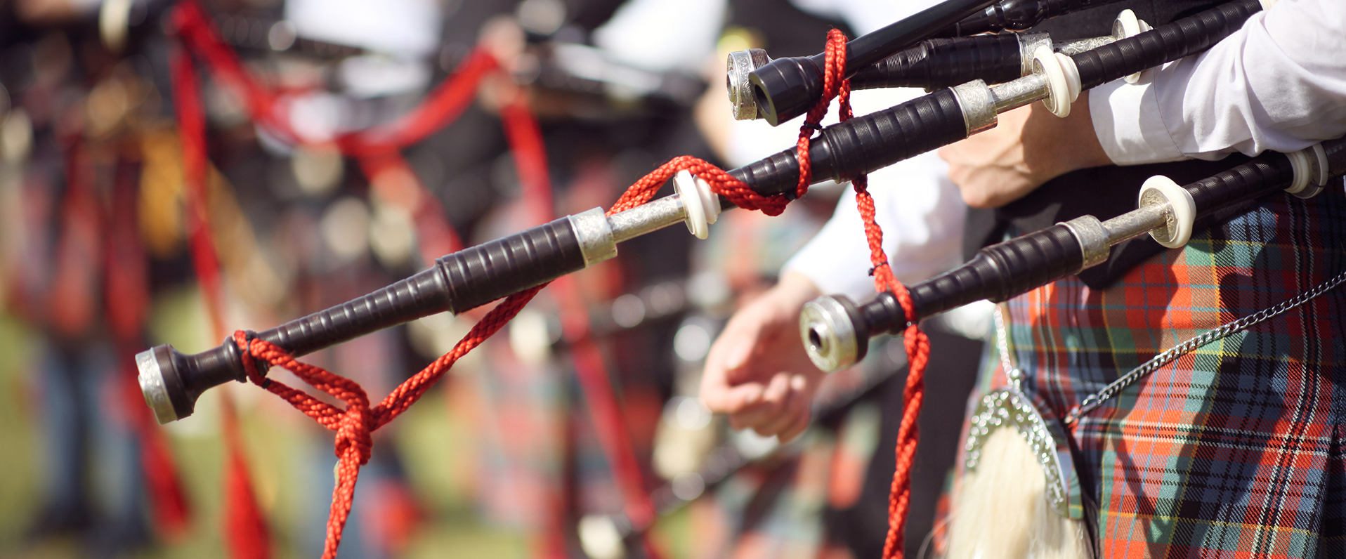 A man in tartan holds bagpipes, promoting a podcast about bagpipe music